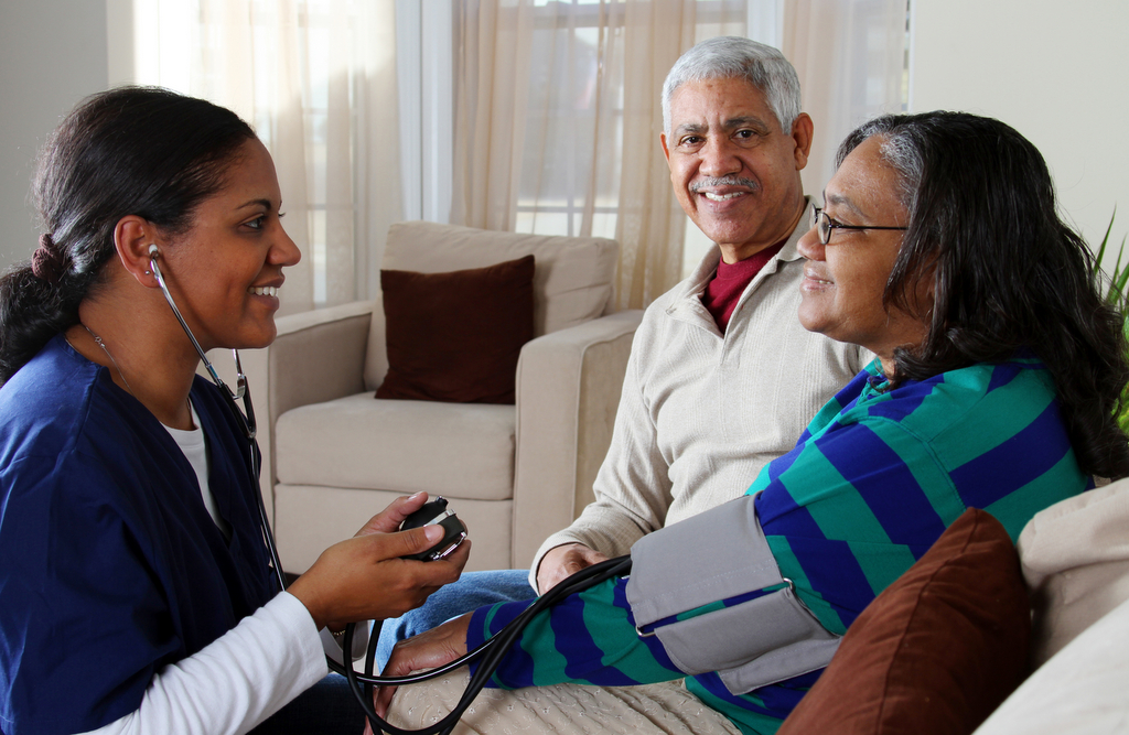 Elderly Couple and Medical Professional