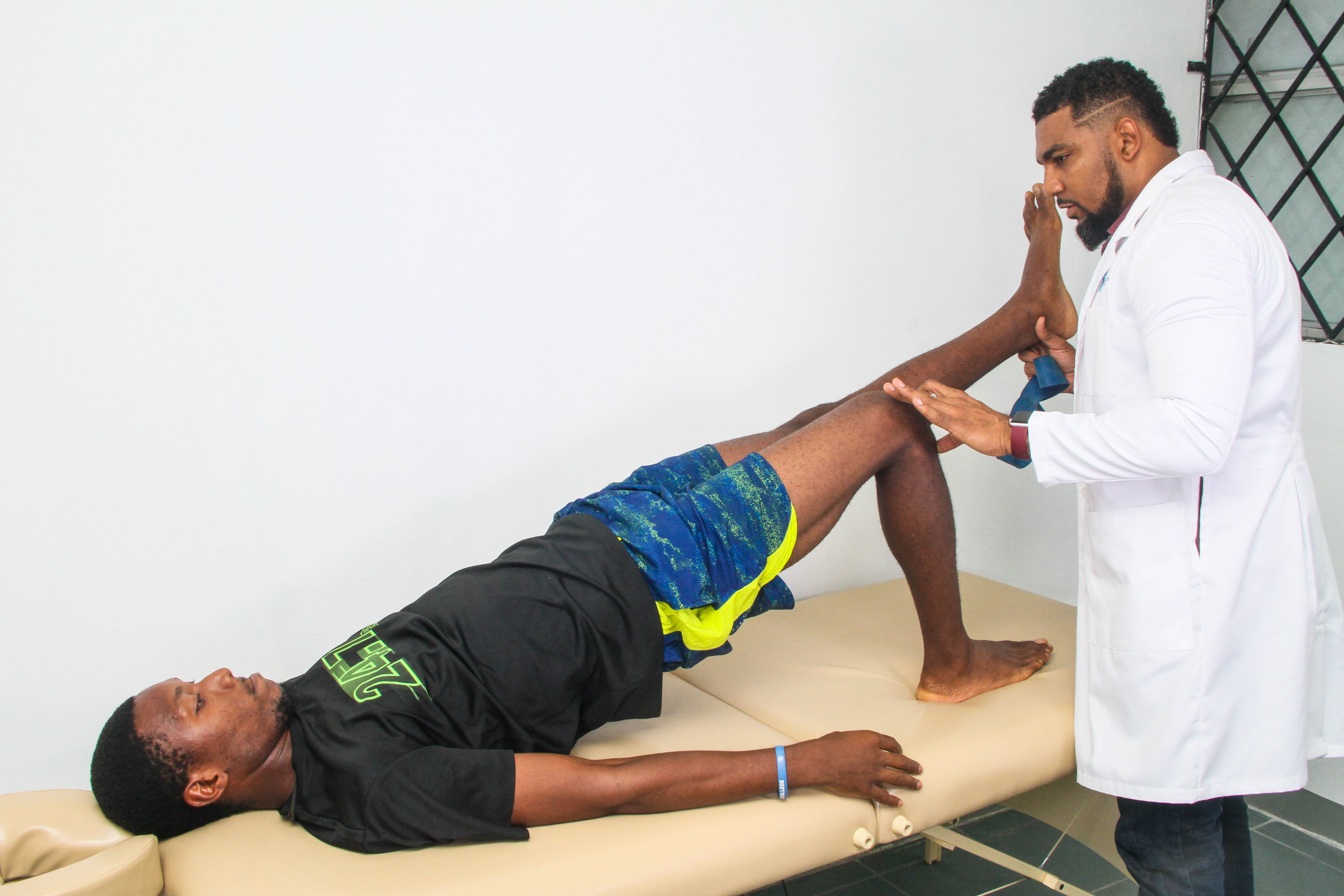 Physiotherapist Andre Duncan helps a patient
